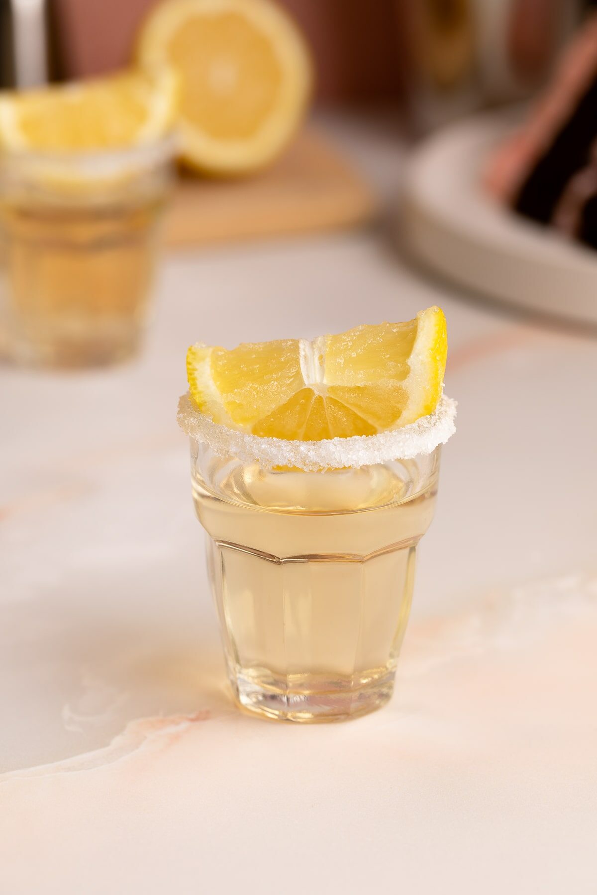 chocolate cake shot with sugar rim and lemonup close.