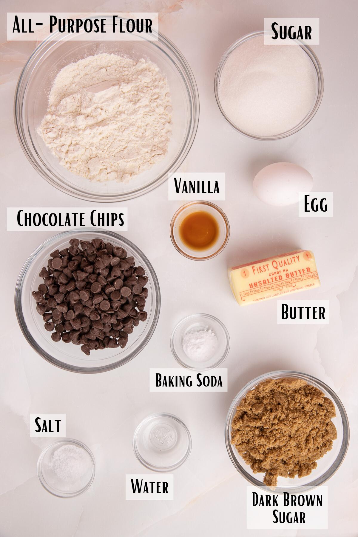 crispy chocolate chip cookie ingredients of flour, chocolate chips, vanilla, egg, butter, sugar, brown sugar, water, baking soda and salt.