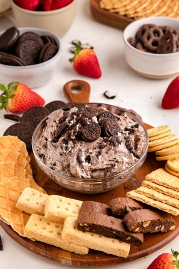 ore dip on serving platter with cookies from side.