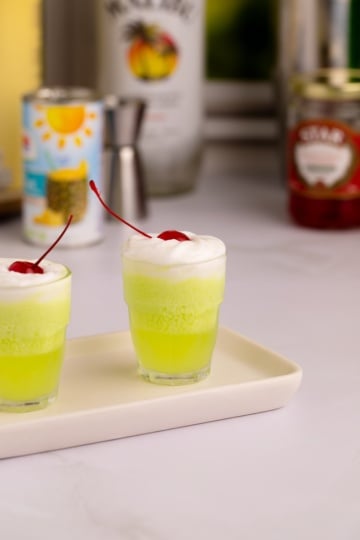 scooby snack shot in shot glasses with whipped cream.