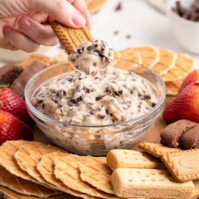 dipping cookie into chocolate chip dip.