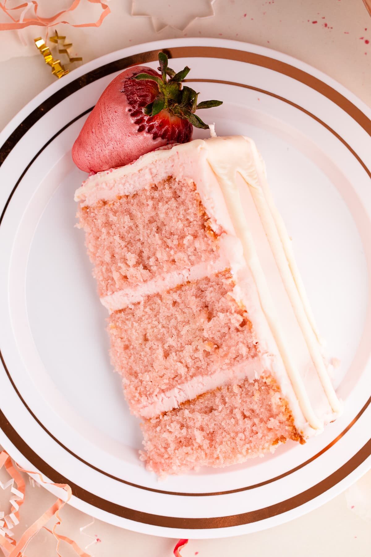 pink champagne cake slice up close.