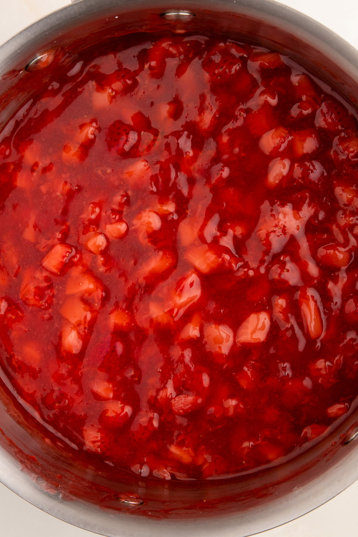 strawberry filling in saucepan up close.