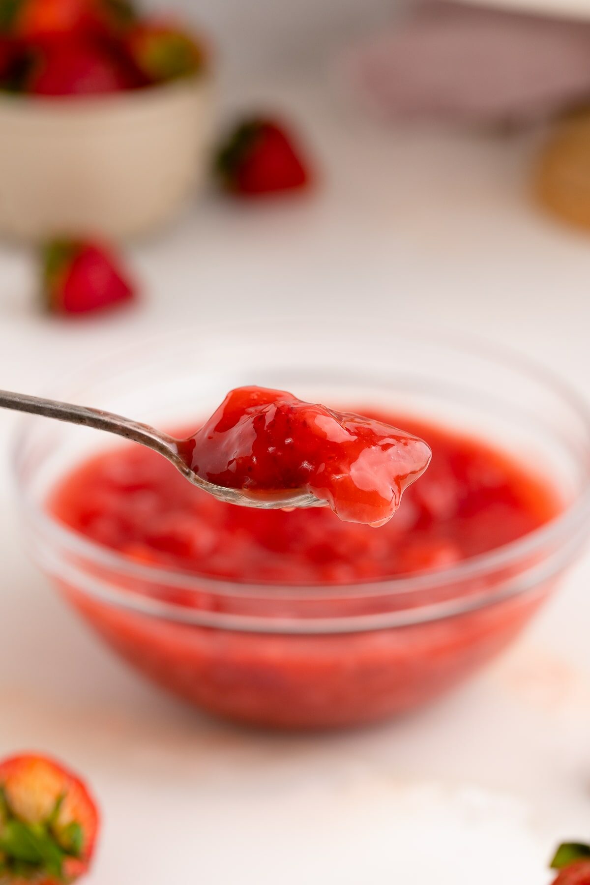 strawberry cake filling on spoon.