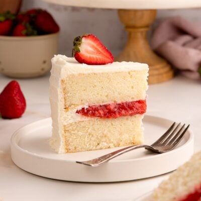 Vanilla Cake with Strawberry Filling on plate up close.