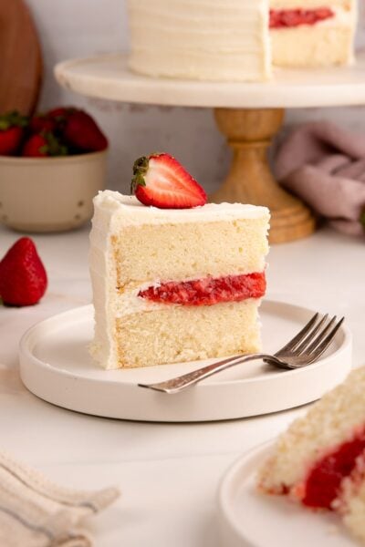 Vanilla Cake with Strawberry Filling on plate up close.