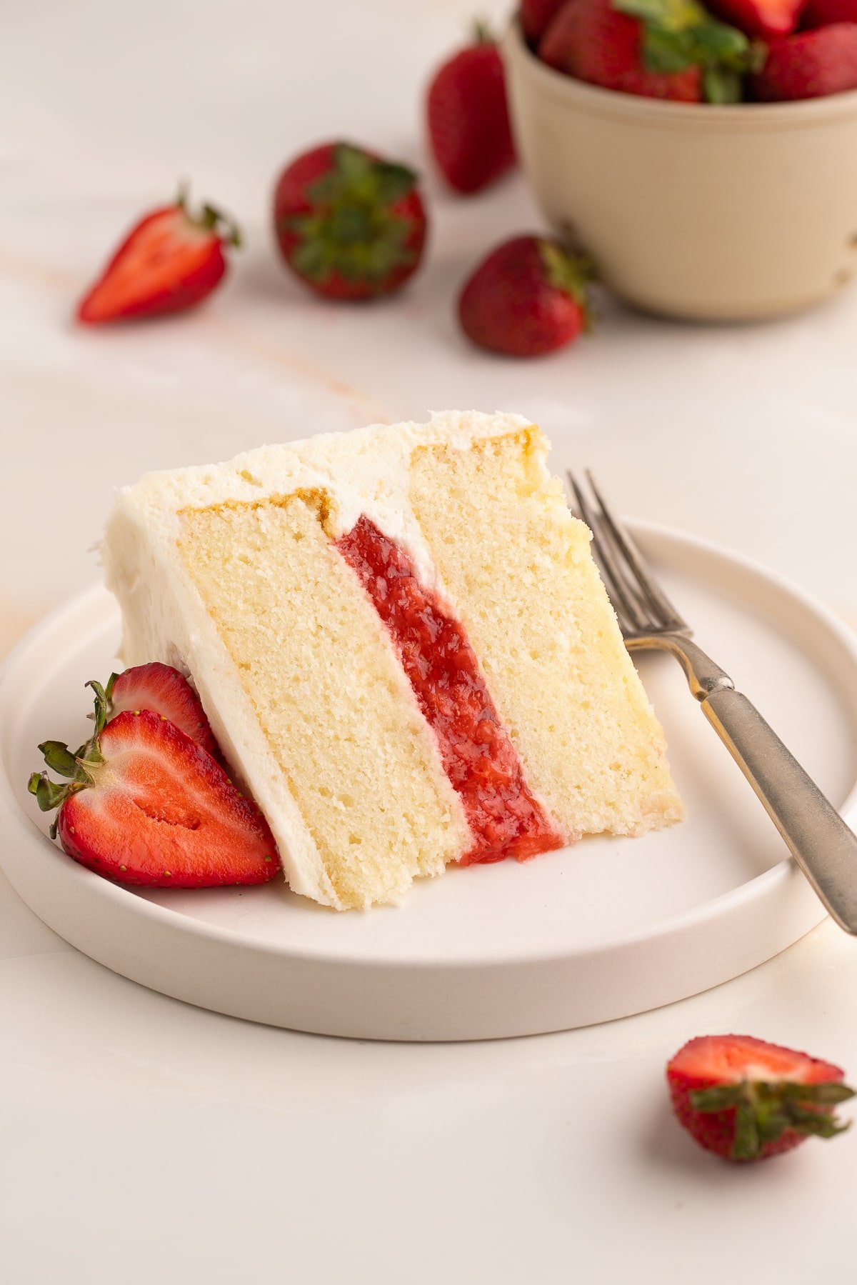 Vanilla Cake with Strawberry Filling on plate.