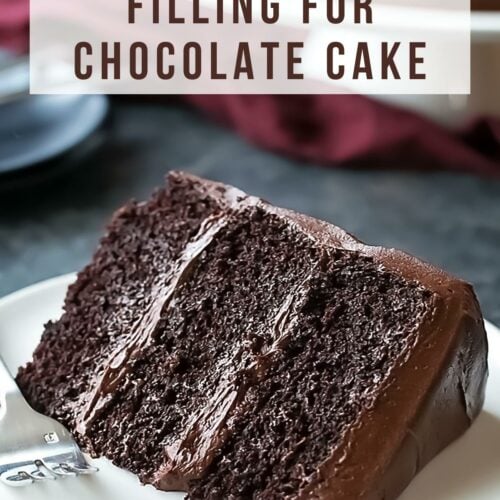 chocolate layer cake with chocolate filling on plate.