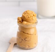 edible peanut butter cookie dough in glass container.