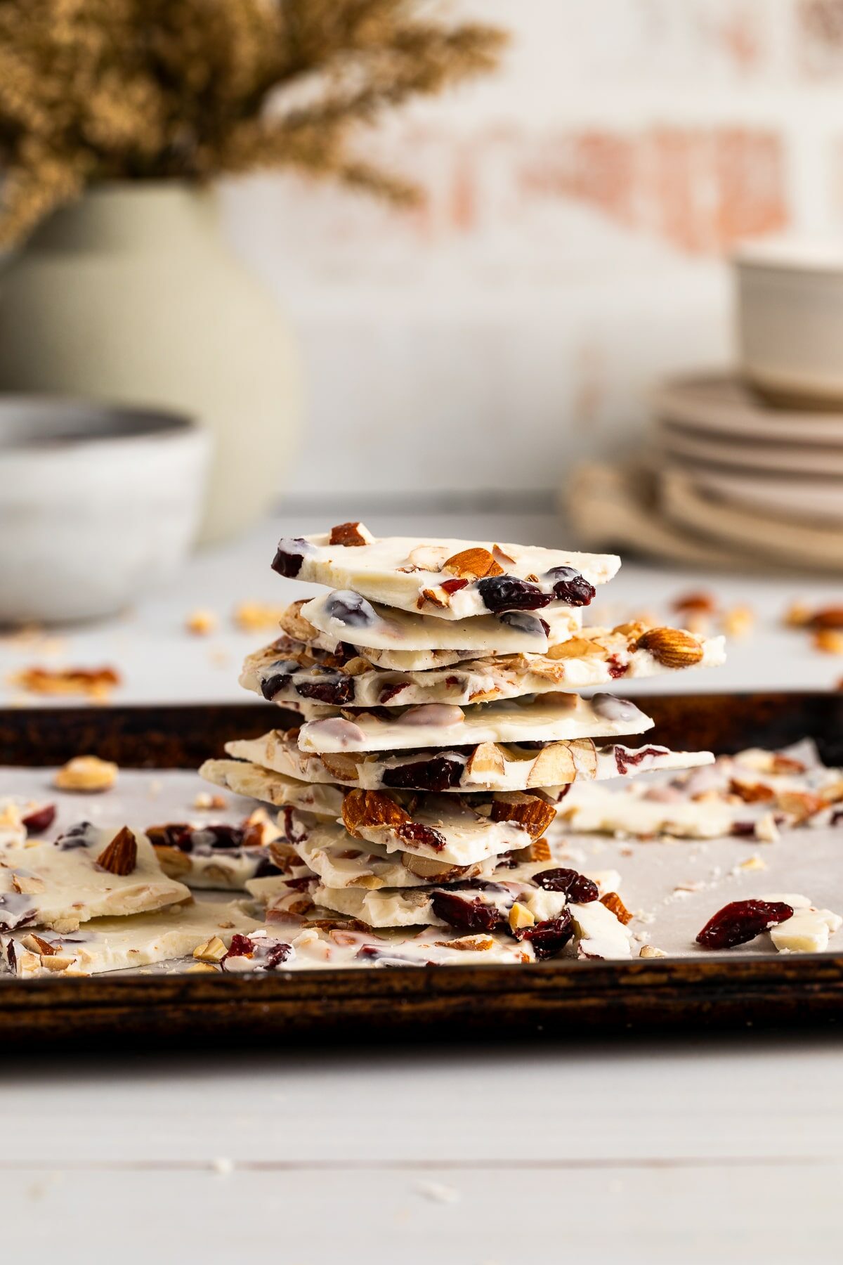 a stack of white chocolate bark on baking sheet.