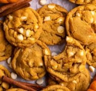 pumpkin white chocolate chip cookies on parchment.