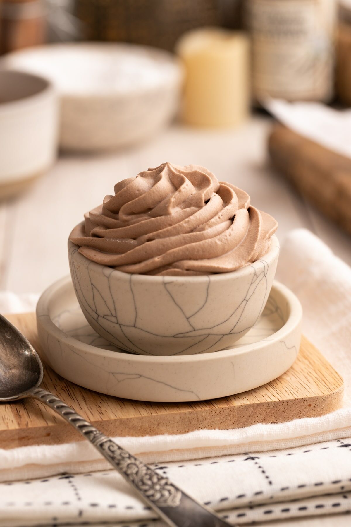 Chocolate Whipped Cream piped in serving bowl up close.