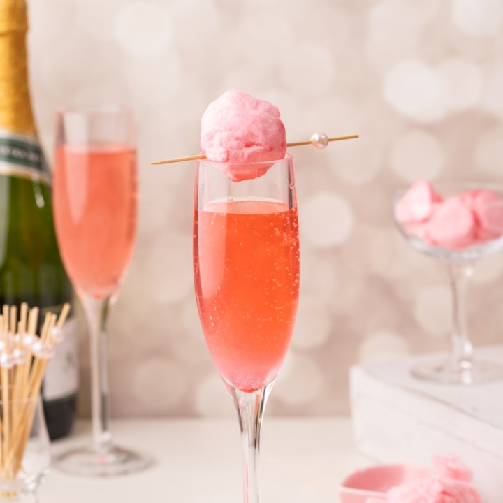 cotton candy glitter bomb on top of glass.