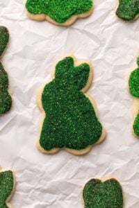 cookies decorated in edible moss on parchment up close.