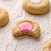 thumbprint cookie with bite out of it.