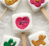 marshmallow pops on parchment paper.