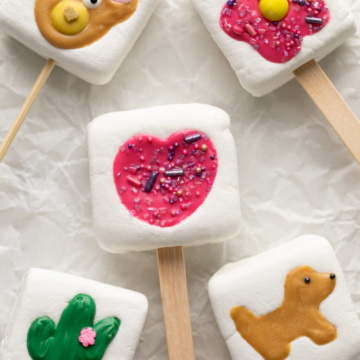 marshmallow pops on parchment paper.