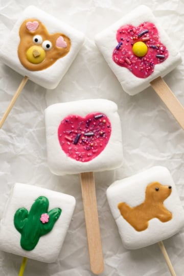 marshmallow pops on parchment paper.