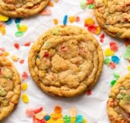 fruity pebble cookies on parchment up close.