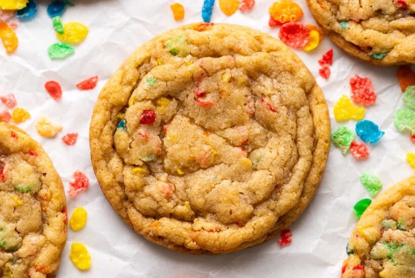 fruity pebble cookies on parchment up close.