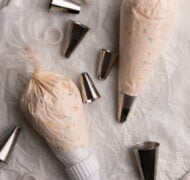 piping bags with filling on parchment.