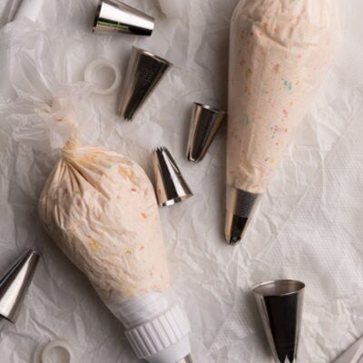 piping bags with filling on parchment.