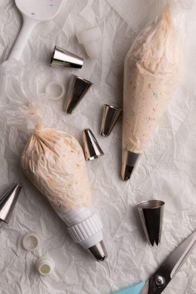 piping bags with filling on parchment.
