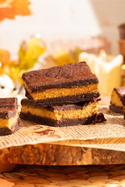 brownies stacked on parchment.