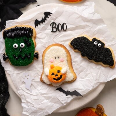 decorated halloween sugar cookies on parchment paper.