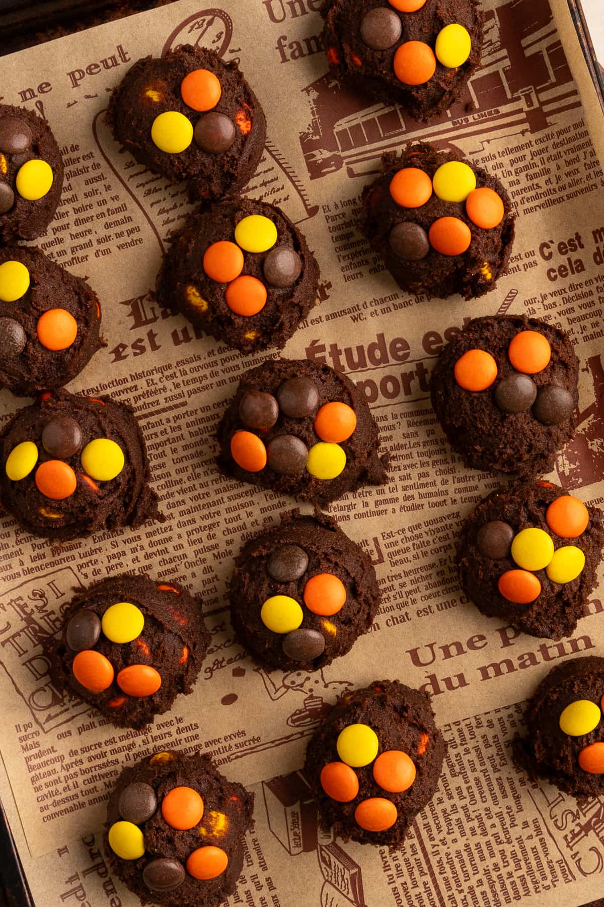 reese's pieces chocolate cookie dough balls on parchment.