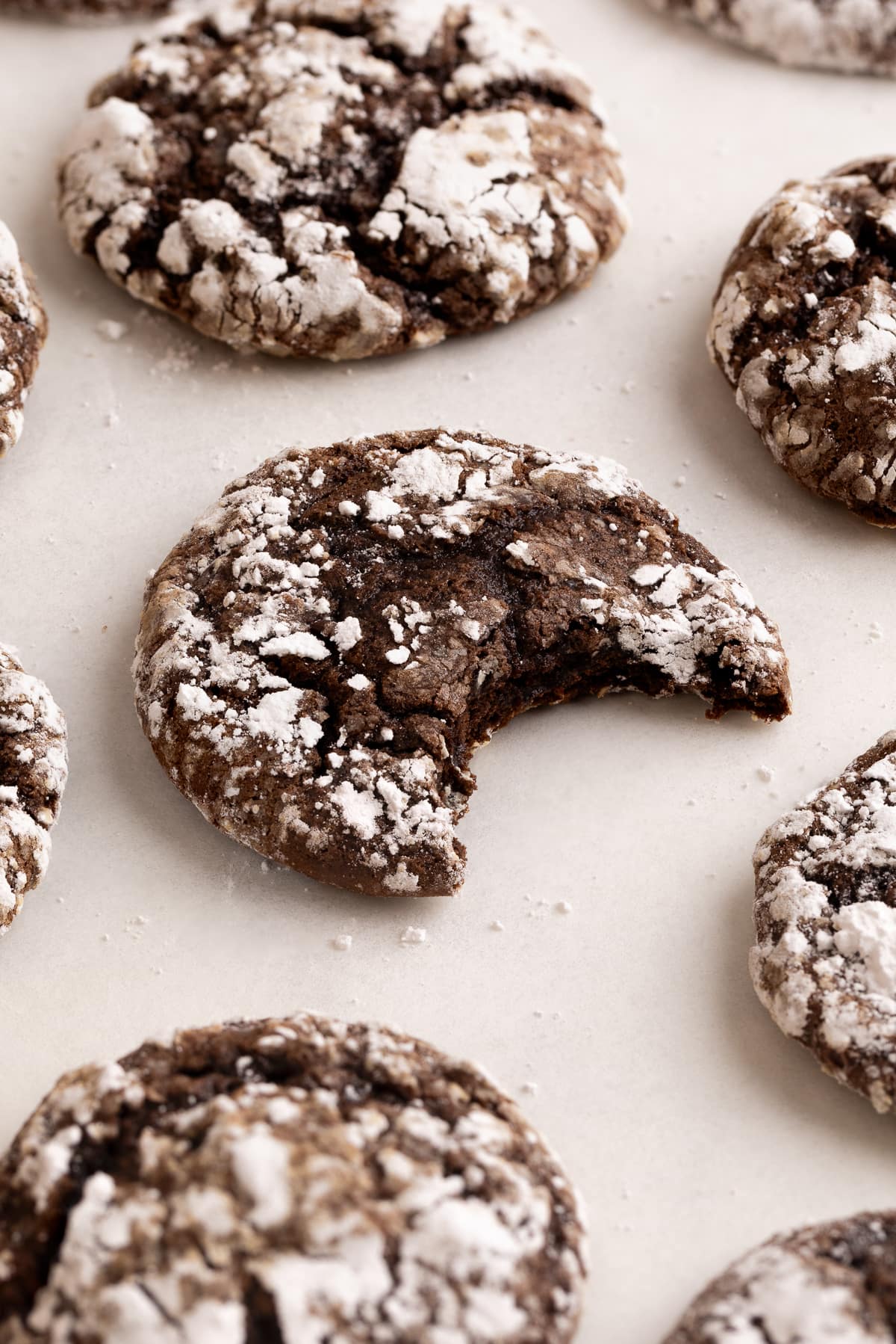 cookie on parchment with bite taken out.