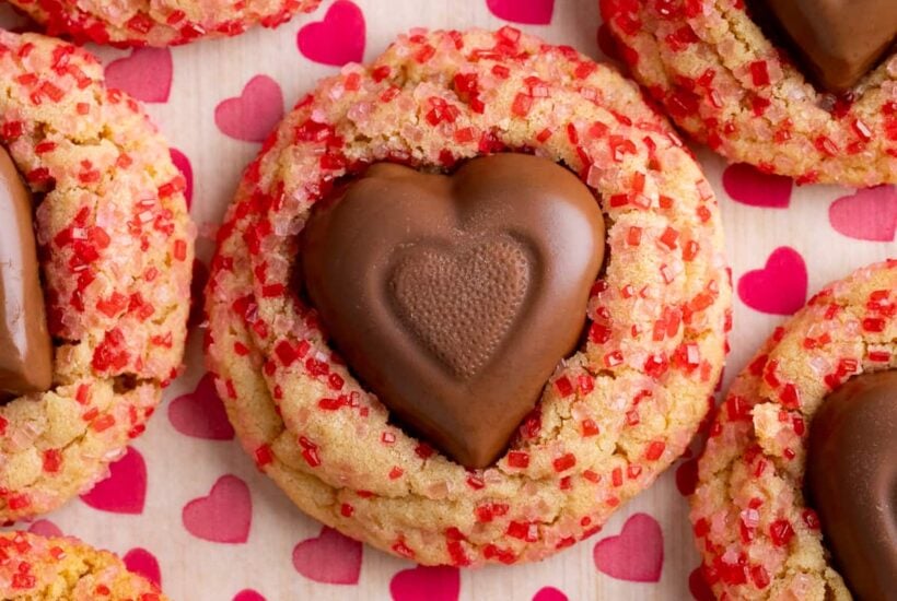 peanut butter heart cookie on parchment paper.