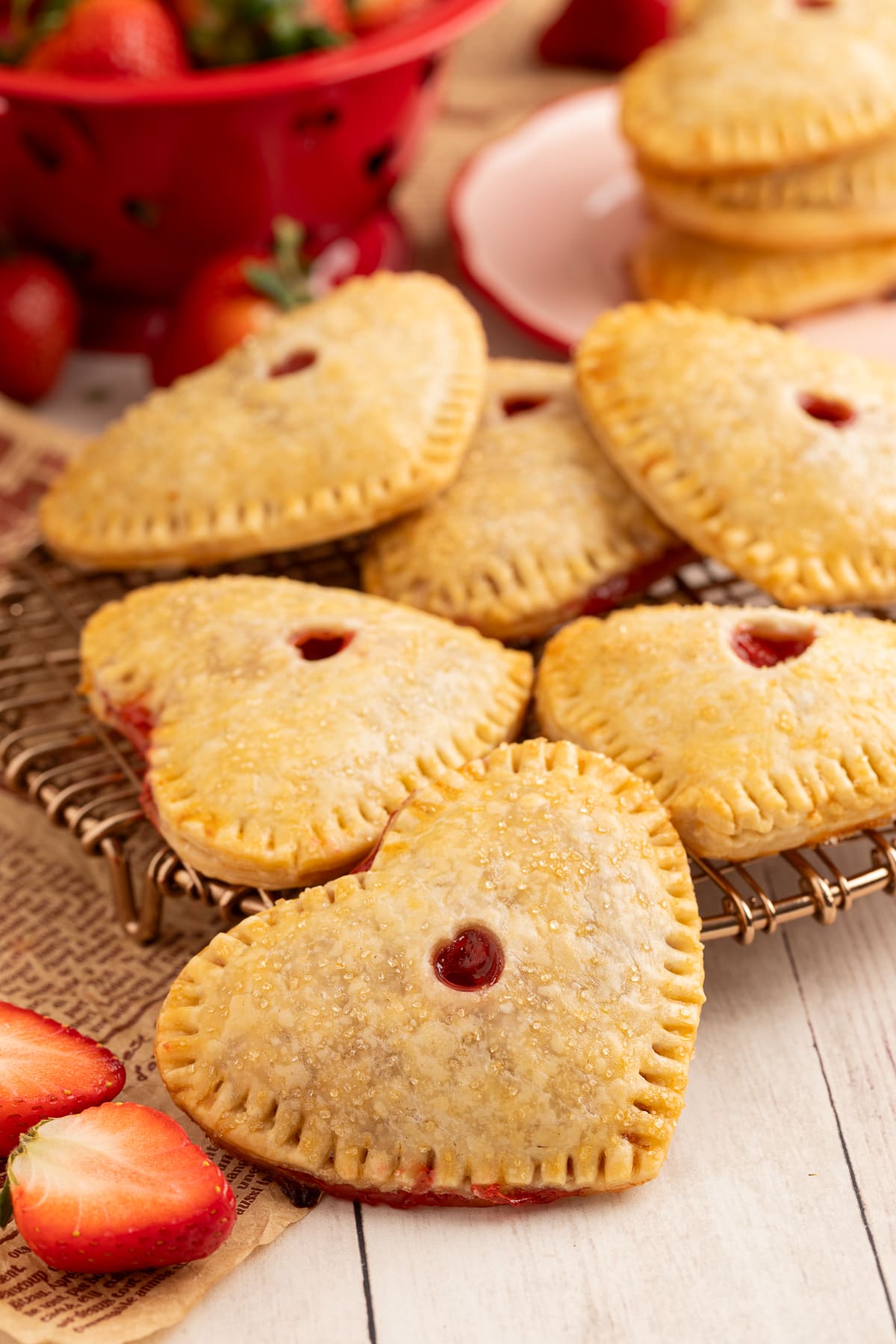 strawberry hand pies on a cooling rack.