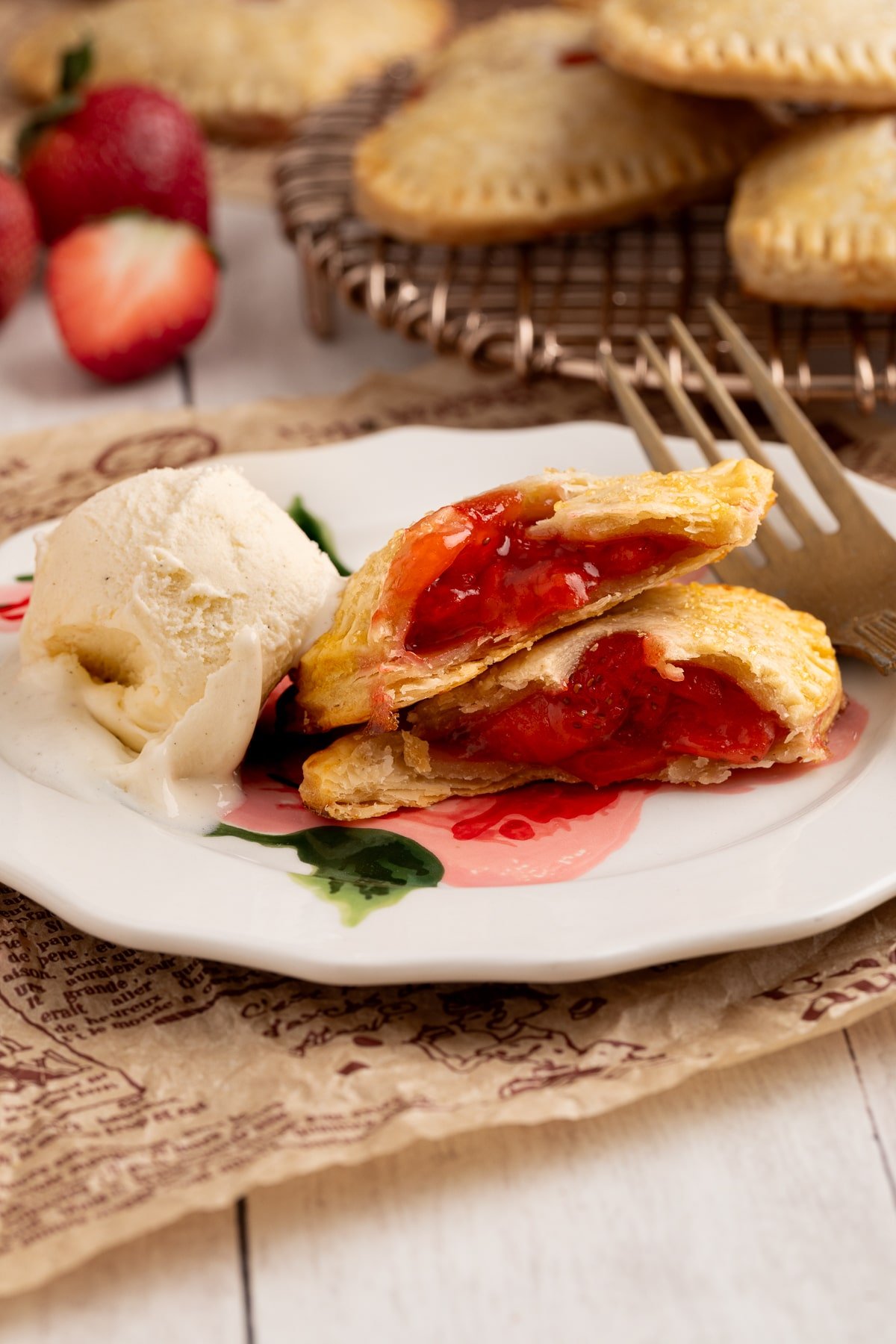 strawberry hand pie broken in half.