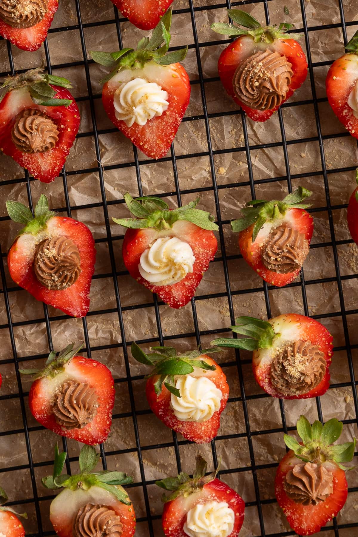 chocolate and vanilla deviled strawberries on prep tray.