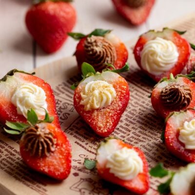 chocolate and vanilla deviled strawberries on a serving platter.