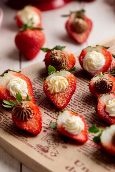 chocolate and vanilla deviled strawberries on a serving platter.