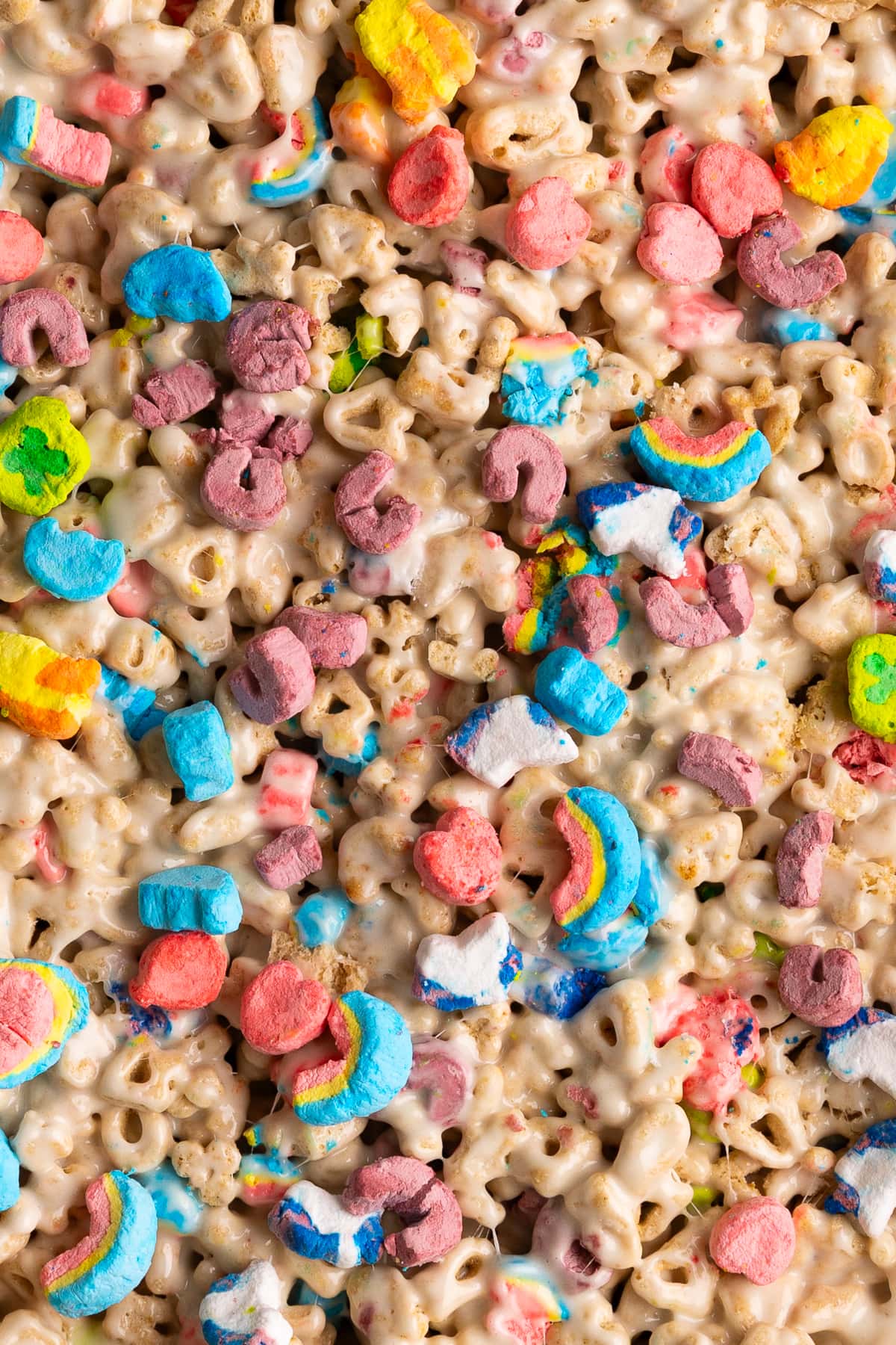 lucky charms treats uncut up close in pan.