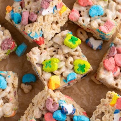 lucky charms treats cut into squares on parchment.