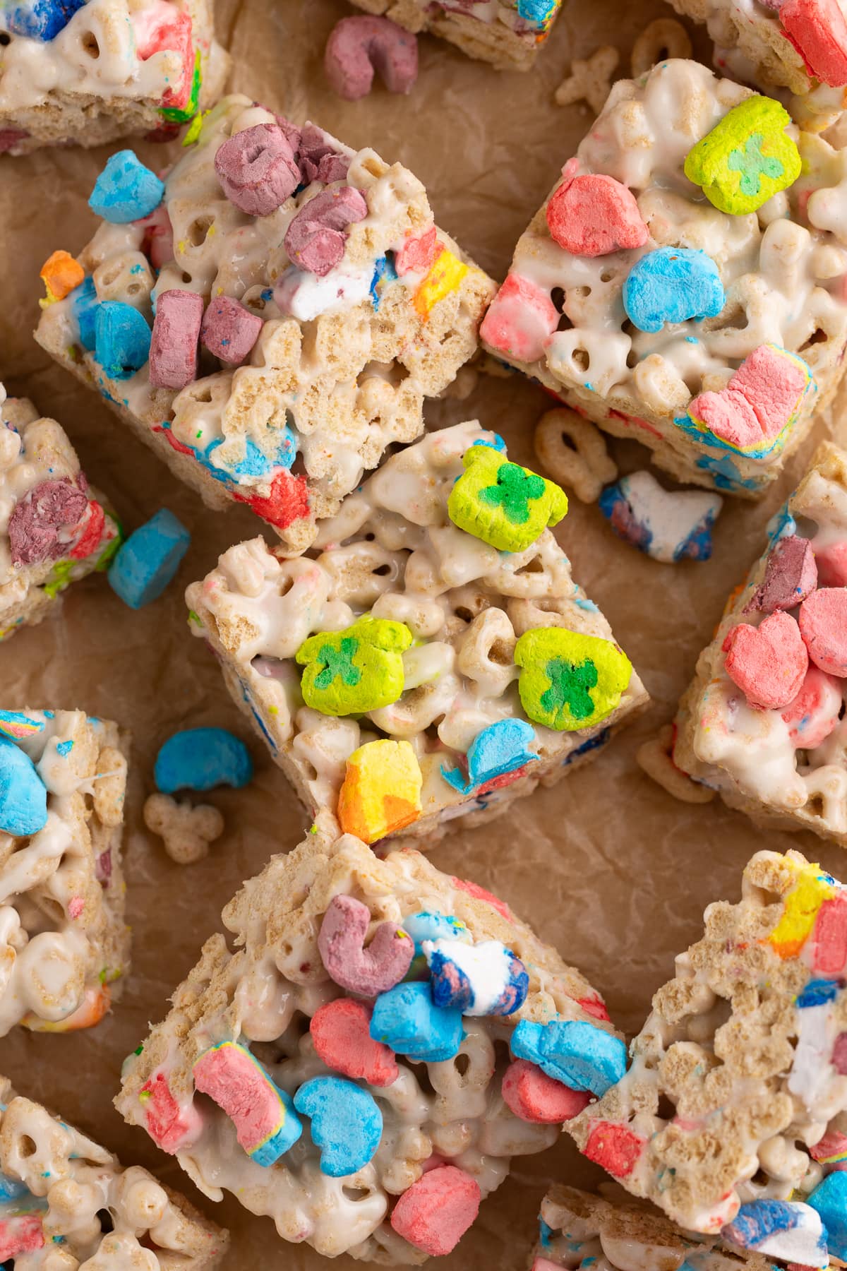 lucky charms treats cut into squares on parchment. 