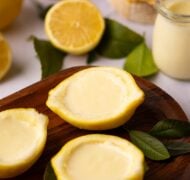 lemon posset in lemon halves.