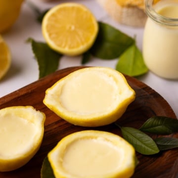 lemon posset in lemon halves.