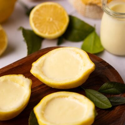 lemon posset in lemon halves.