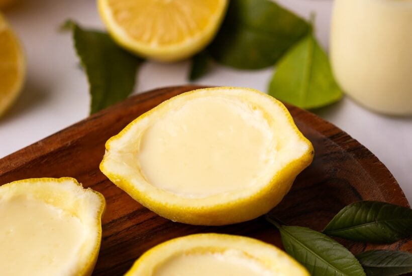 lemon posset in lemon halves.