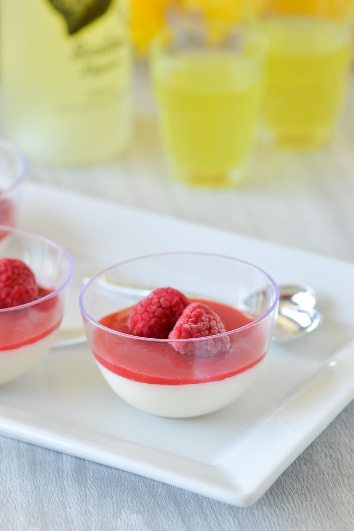 limoncello panna cotta in serving bowls with berries.