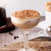 tiramisu cocktail with whipped cream up close.