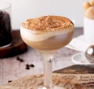 tiramisu cocktail with whipped cream up close.