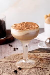 tiramisu cocktail with whipped cream up close.