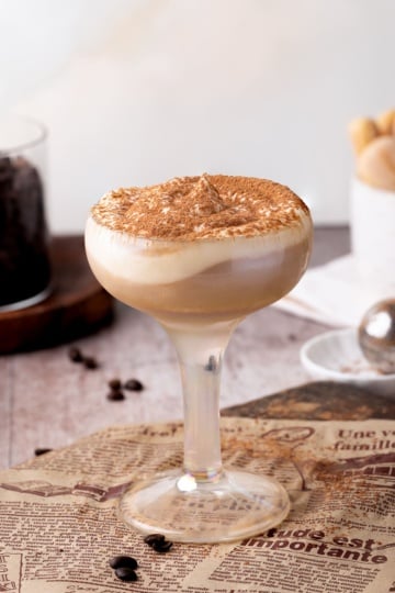 tiramisu cocktail with whipped cream up close.