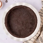 oreo pie crust in pie tin top view.